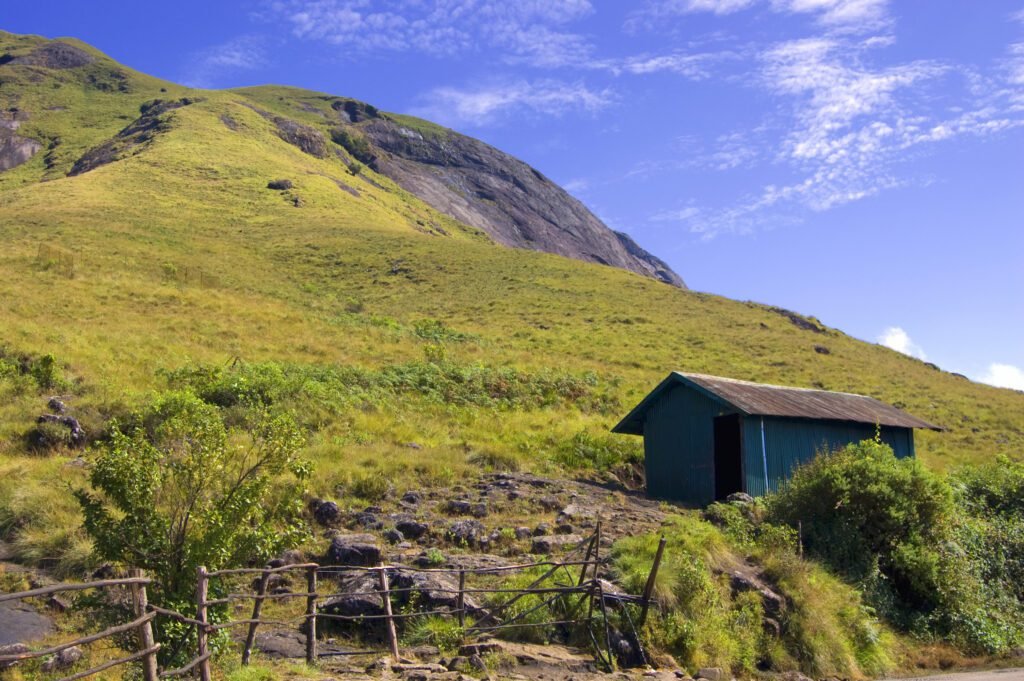 a small shed on a hill